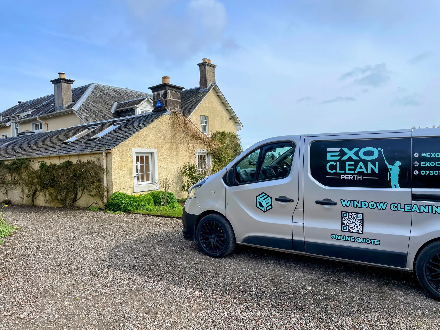 The ExoClean van outside a traditional stone country house
