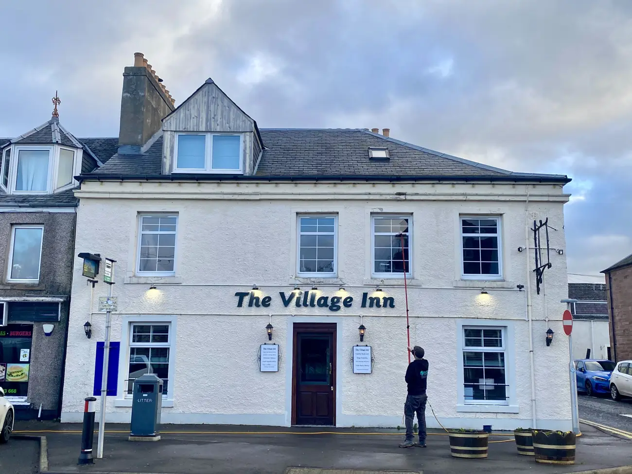 Cleaning the windows of The Village Inn, Bridge of Earn